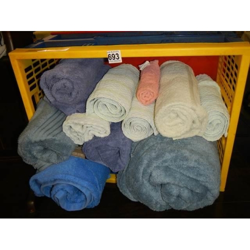 693 - A crate of assorted towels.