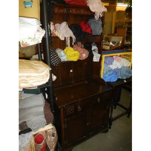 695 - An oak open rack dresser, COLLECT ONLY.