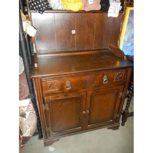 695 - An oak open rack dresser, COLLECT ONLY.