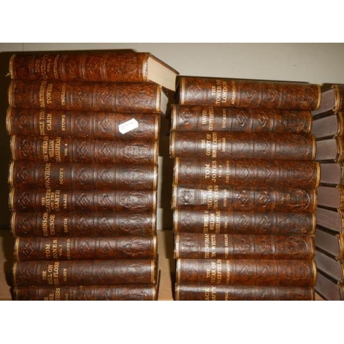 712 - A large lot of hard back books.