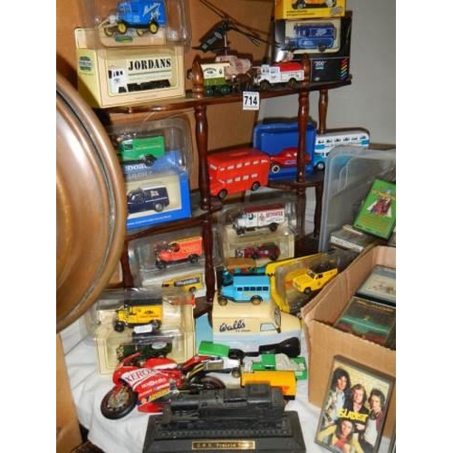 714 - A mixed lot of die cast models with shelf. COLLECT ONLY.