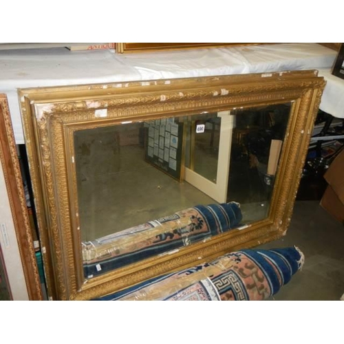 690 - A Victorian bevel edged mirror,. COLLECT ONLY.