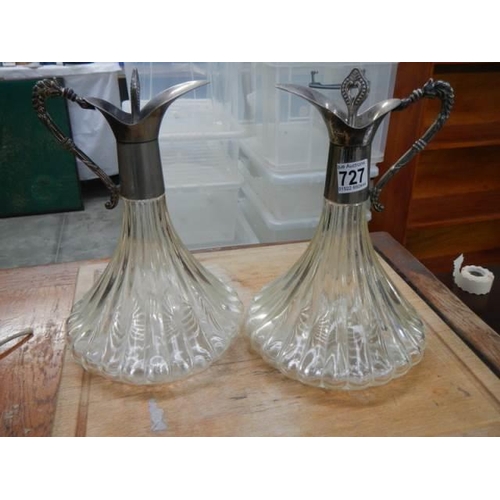 727 - A pair of mid 20th century glass claret jugs.