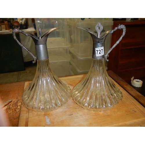 727 - A pair of mid 20th century glass claret jugs.