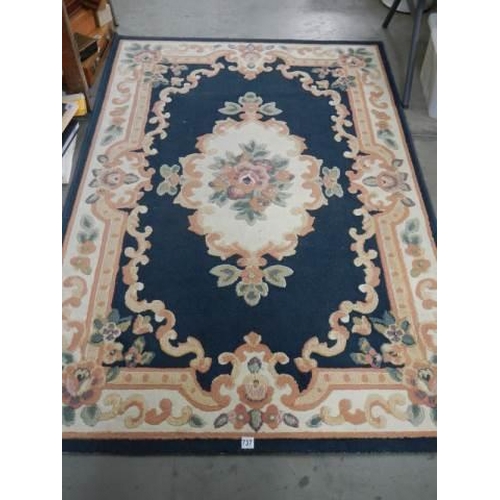 737 - A blue patterned rug, 170 x 120 cm.