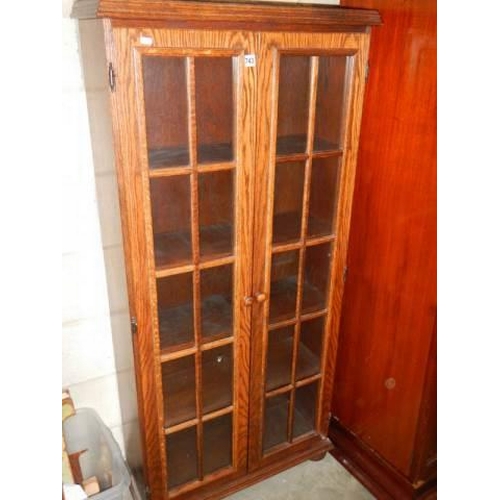 743 - A good oak two door cabinet, COLLECT ONLY.