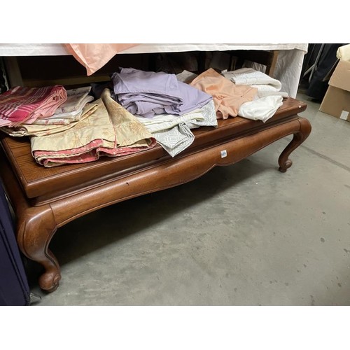 699 - A good quality solid mahogany coffee table on Queen Anne legs and with glass top, COLLECT ONLY.