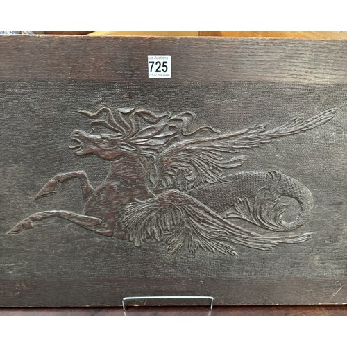 725 - A carved wood panel featuring a horse,.