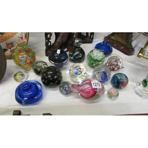 1279 - A good lot of glass paperweights and specimen vases.