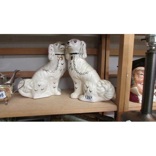 1297 - A pair of Staffordshire spaniels.