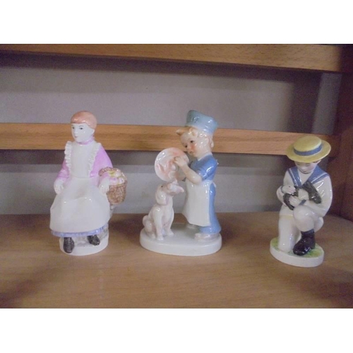 1319 - A Royal Worcester figurine and four others.