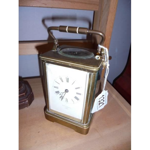 1321 - A French brass striking carriage clock by T. r. Russell, 3283, Paris.