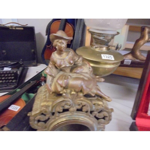 1324 - A Victorian brass clock case surmounted figure (figure loose).