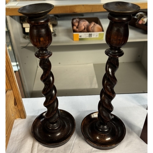 95 - An oak barometer with rope twist case & porcelain dial & A pair of 1930s oak candlesticks