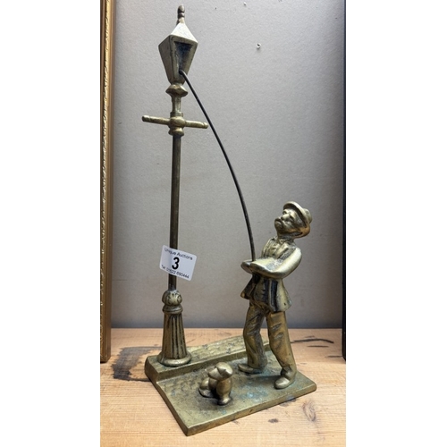 3 - A solid brass figure of a Victorian lamp lighter with dog