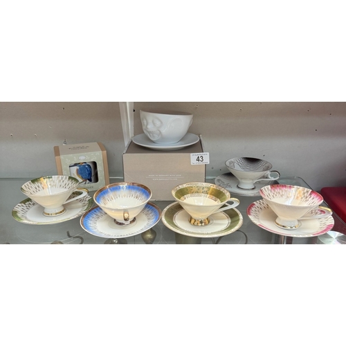 43 - A quantity of Bavarian cups & saucers, A boxed smiling cup & saucer & A boxed Kingfisher mug