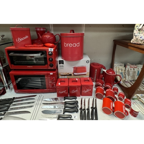 46 - A quantity of red kitchenware including Microwave, grill, toaster etc & A quantity of Nescafe items ... 