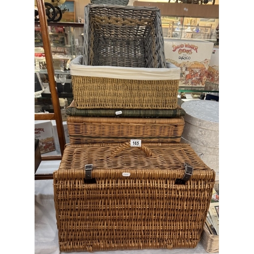 165 - A quantity of wicker baskets including picnic basket, hat/storage boxes and quantity of unused celeb... 