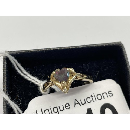 1019 - A 14ct yellow gold sapphire and diamond ring, size O half, 2.4 grams.