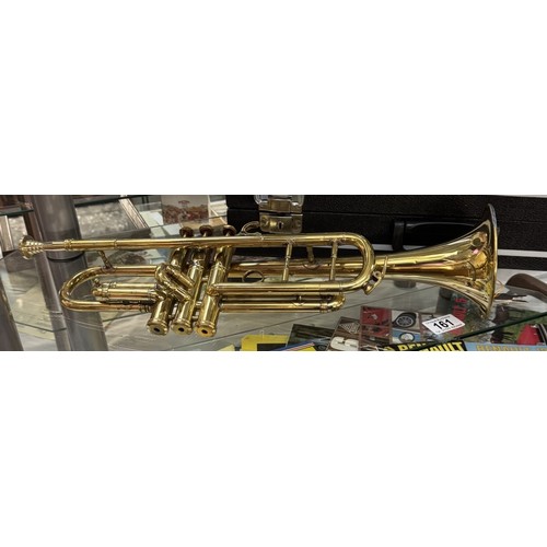 161 - A cased brass trumpet