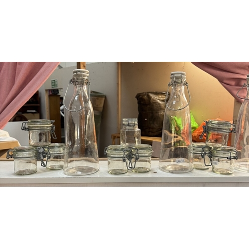 241 - A selection of clip top bottles & jars, Small glass display domes, Shot glasses & Comical vases