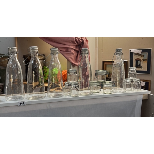 241 - A selection of clip top bottles & jars, Small glass display domes, Shot glasses & Comical vases