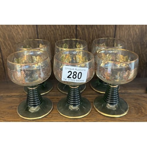 280 - 14 German style green stemmed wine glasses (6 with vine decorations)