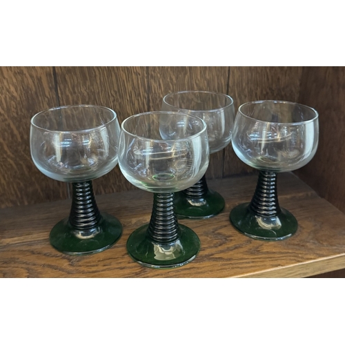 280 - 14 German style green stemmed wine glasses (6 with vine decorations)