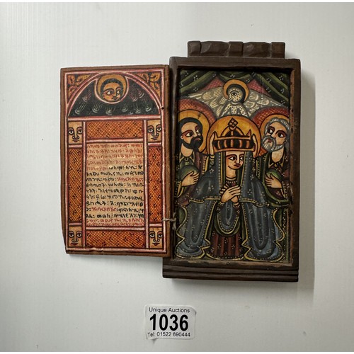 1036 - An antique hand painted icon in carved wood case (possibly Russian).