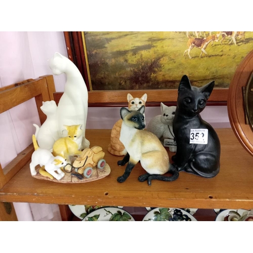 352 - A collection of cat ornaments