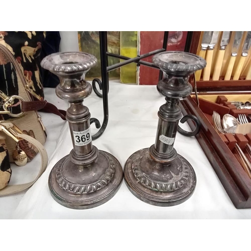 369 - A pair of old Sheffield plate candlesticks