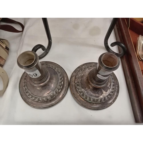 369 - A pair of old Sheffield plate candlesticks