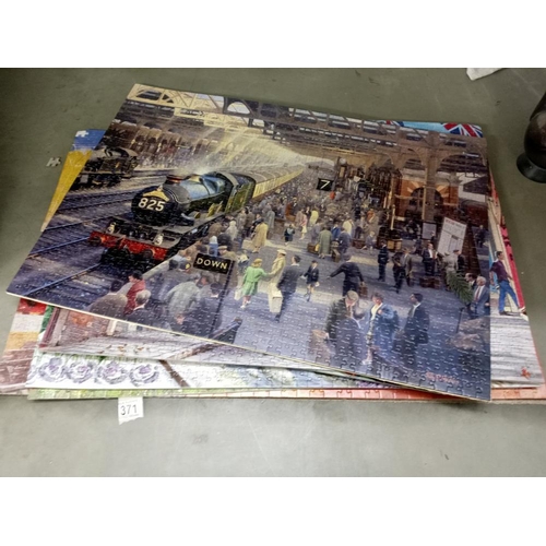 371 - A quantity of old train puzzles glued onto card