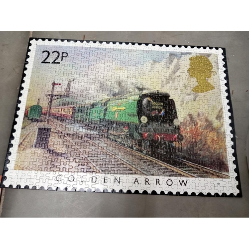 371 - A quantity of old train puzzles glued onto card