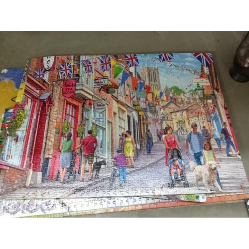 371 - A quantity of old train puzzles glued onto card