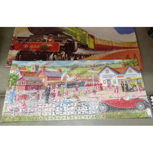 371 - A quantity of old train puzzles glued onto card