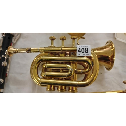 408 - A small brass cornet