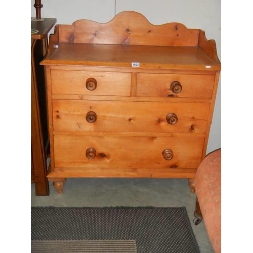 1502 - A two over two pine chest of drawers. COLLECT ONLY.