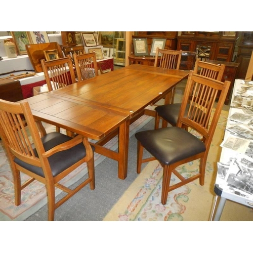 1505 - A good quality oak extending dining table with six chairs. COLLECT ONLY.