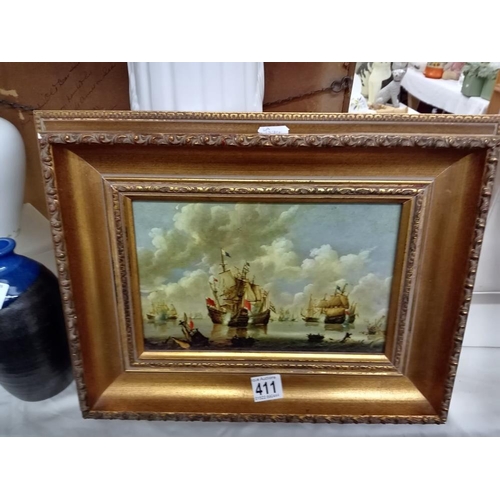 411 - A gilt framed picture of ships