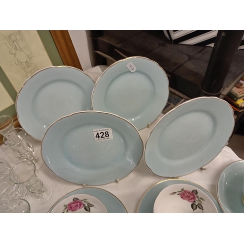 428 - A quantity of bone china cups with rose design, saucers & side plates