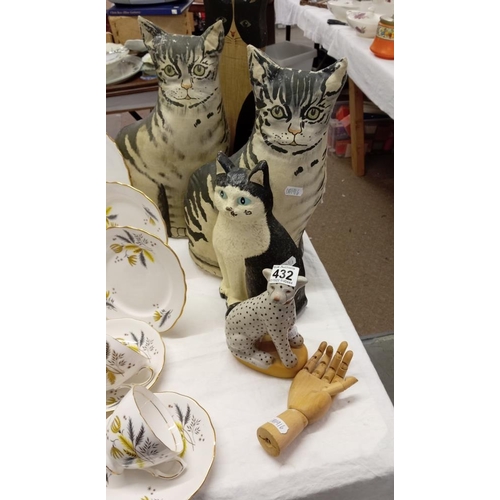 432 - A quantity of cat figures including door stops etc