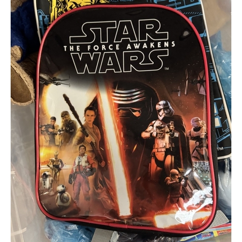 733 - 2 Star Wars backpacks & a box of toys