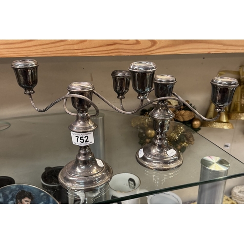 752 - A pair of silver plated candelabras