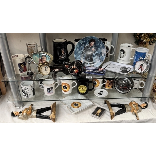 753 - A large quantity of Elvis mugs & clocks etc.