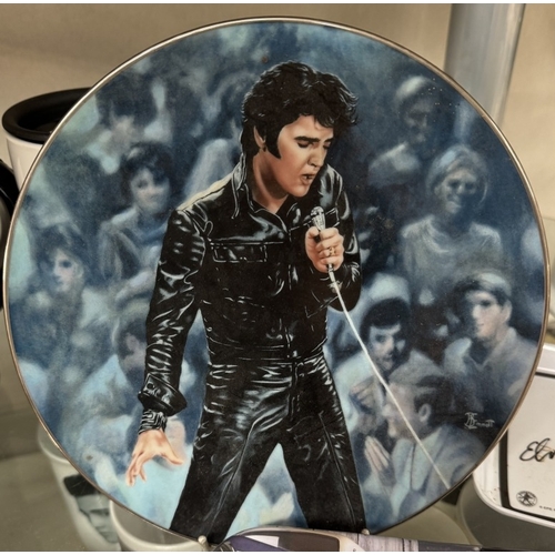 753 - A large quantity of Elvis mugs & clocks etc.