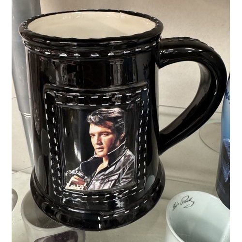 753 - A large quantity of Elvis mugs & clocks etc.