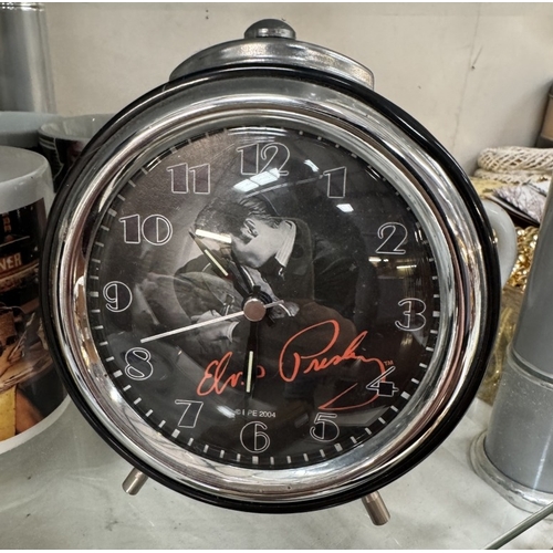 753 - A large quantity of Elvis mugs & clocks etc.