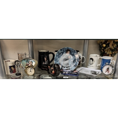 753 - A large quantity of Elvis mugs & clocks etc.