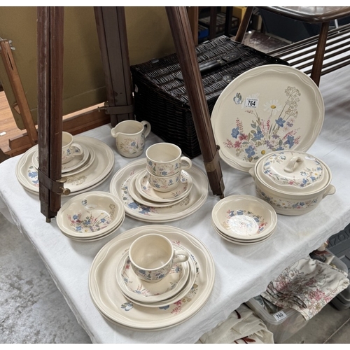 764 - A part Poole pottery Springtime dinner set in wicker basket & A Wedgwood Santa Clara